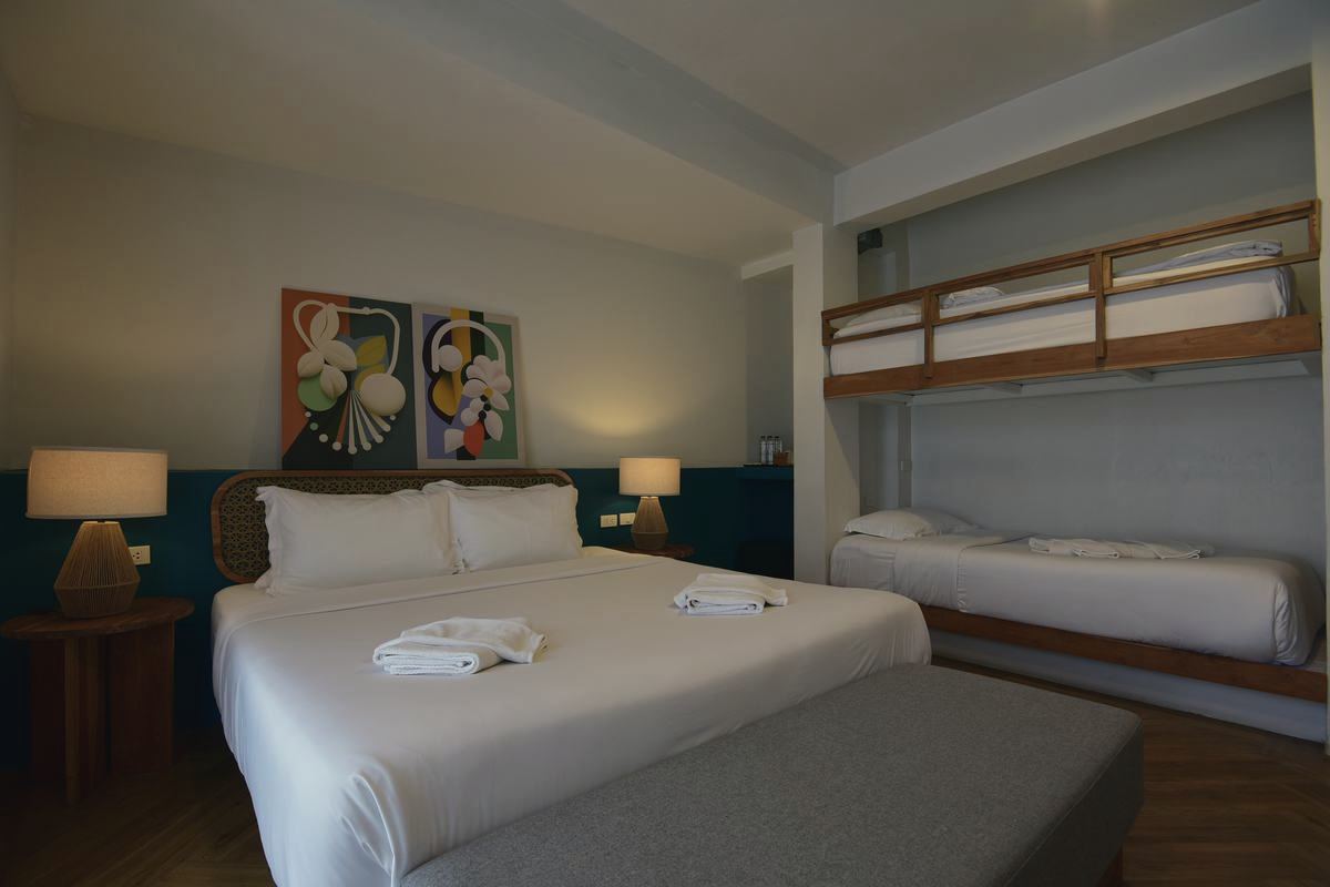 Holy Family room with king bed and bunk beds
