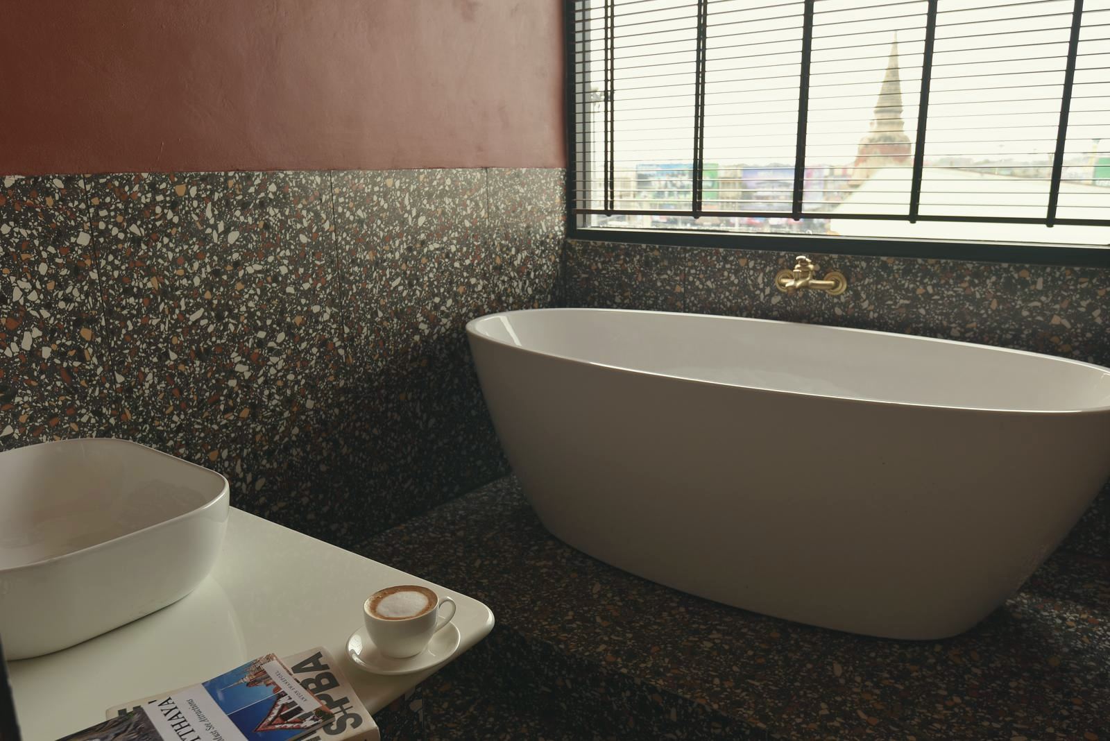 KWANS Suite freestanding bathtub facing a temple prang through the window